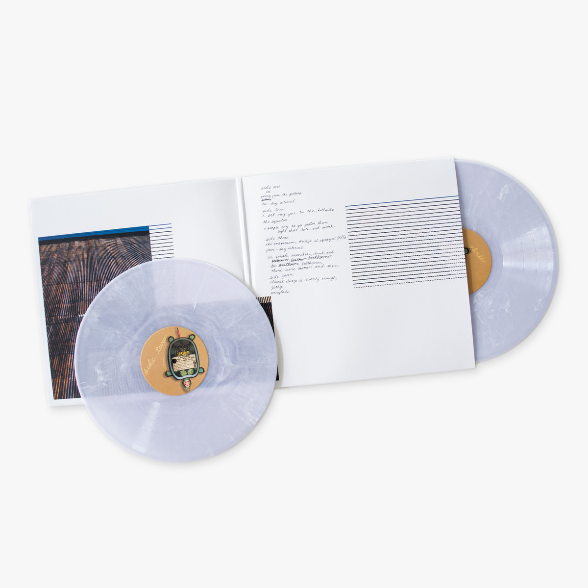 image: tortoise tnt record sleeve with two white vinyl albums partially showing out of the sleeve